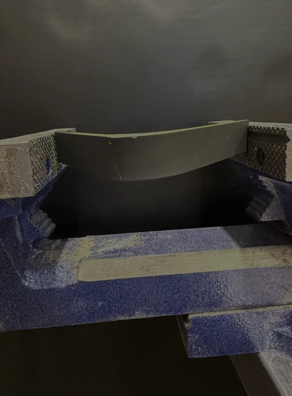 Coated bracket under UV with the top coat intact and no crack