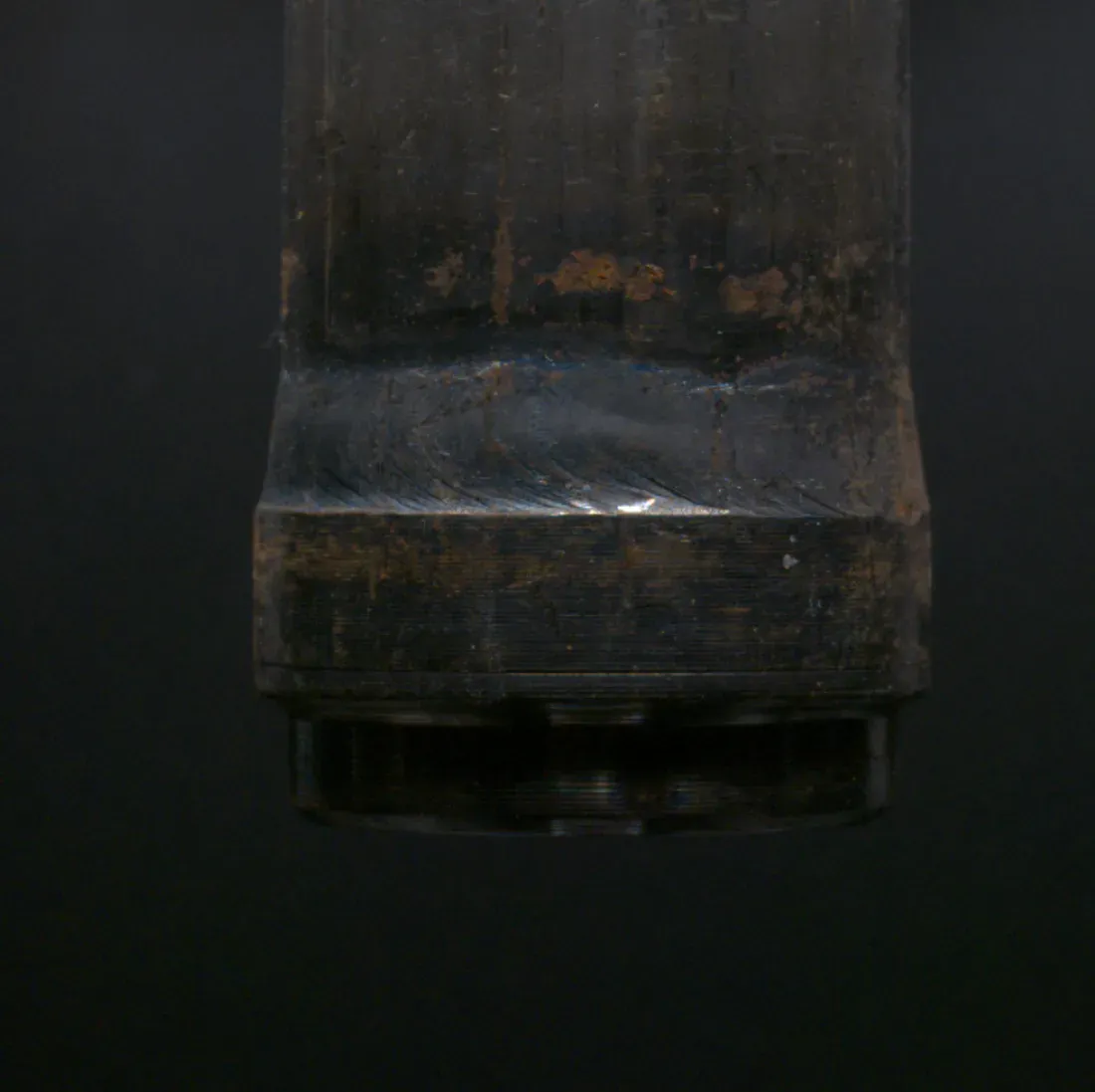 Weld cap on a machined steel component with no visible imperfection