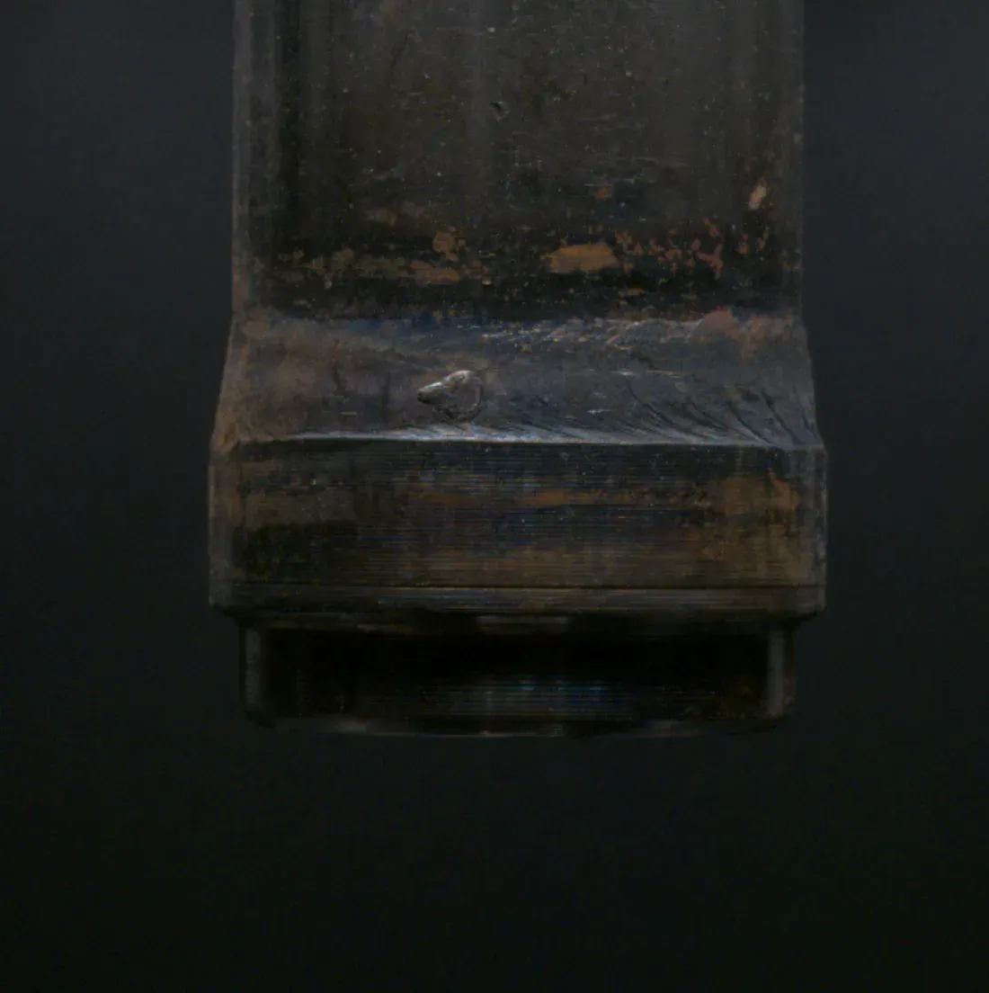 Weld cap with a raised ball of spatter on it